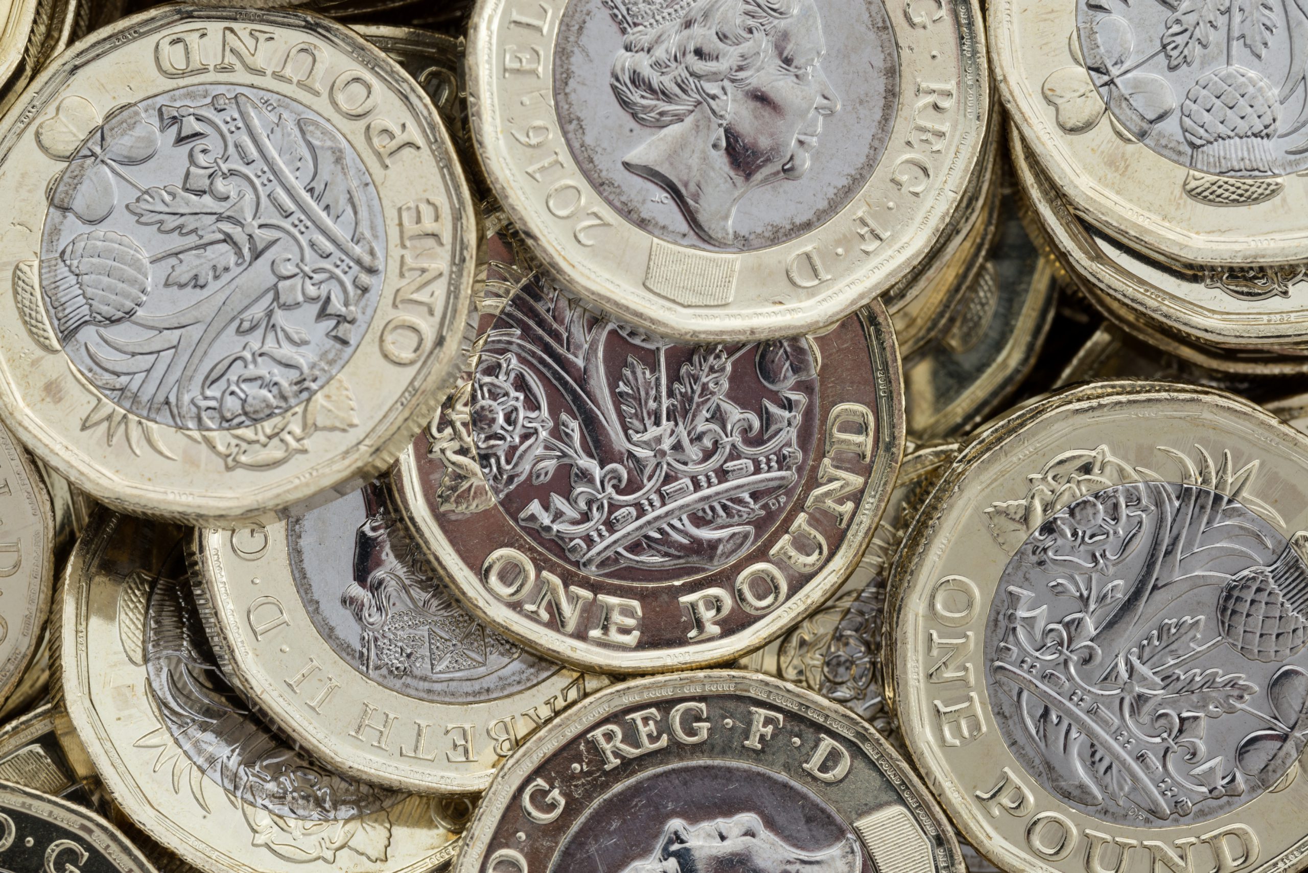 A pile of GBP pound coins.