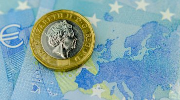 Pound Coin on Euro Banknote GBP/EUR